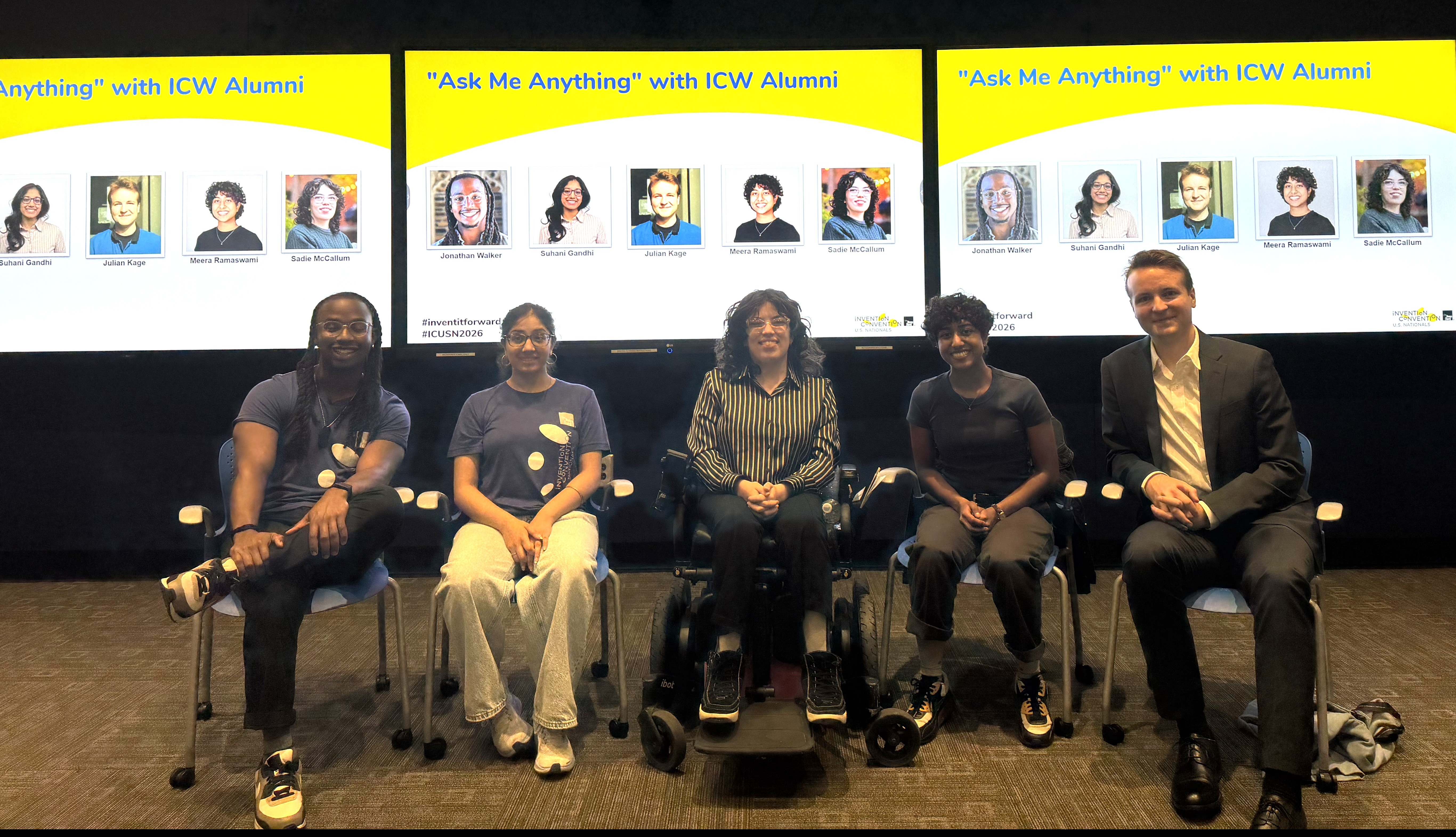 Five people sitting in chairs in front of a screen that features their photos and the title 